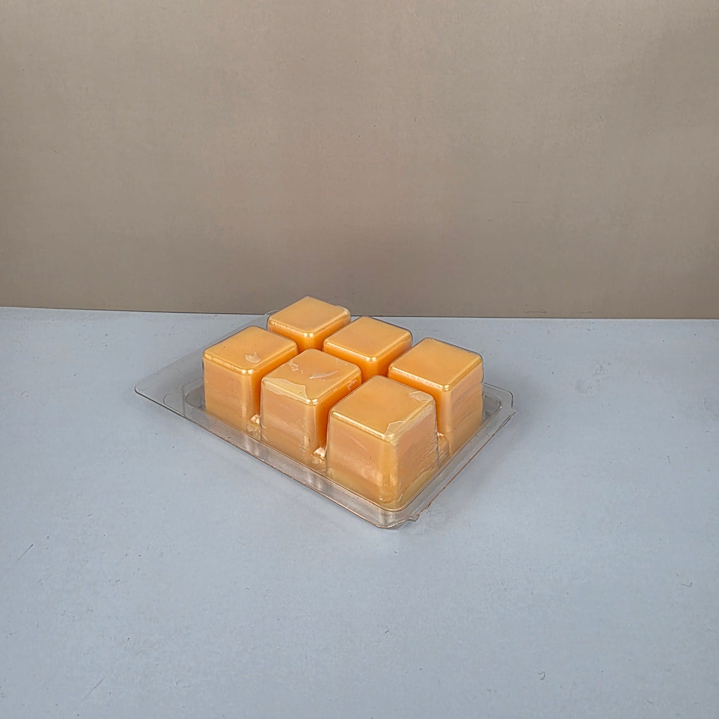 Hexagonal honeycomb wax melt block on a neutral background