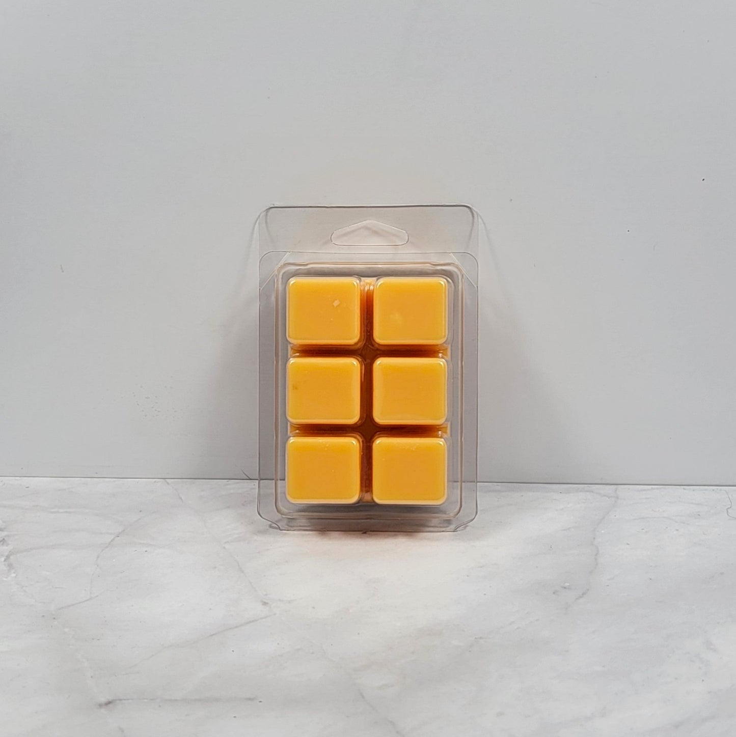 Hand-poured wax melt featuring citrus and gardenia
