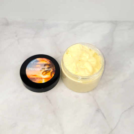 Handcrafted Honolulu Sun Whipped Body Lotion with coconut, palm leaves, and tonka for silky-smooth skin and a sun-kissed, tropical scent