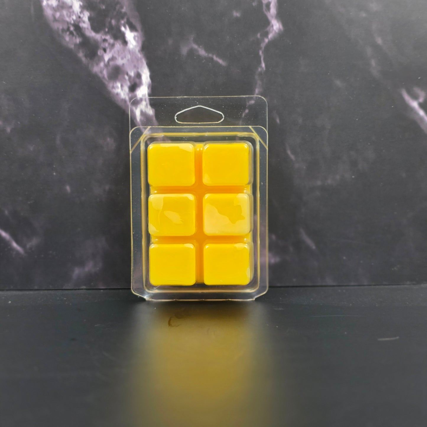 Handcrafted soy wax melt with lemon, lemongrass, and musk