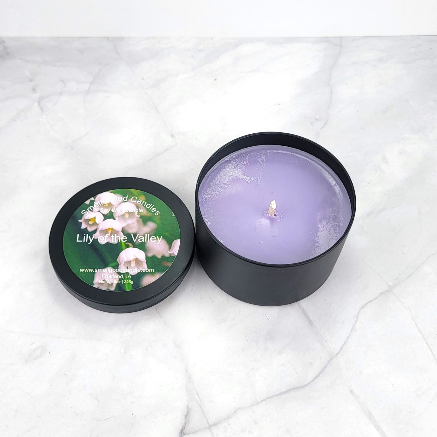 Hand-poured candle with fresh lily, lilac, and musk fragrance.