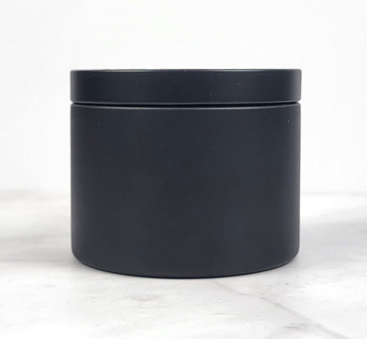 Handcrafted soy candle with notes of citrus, ozone, cotton blossom, and musk.