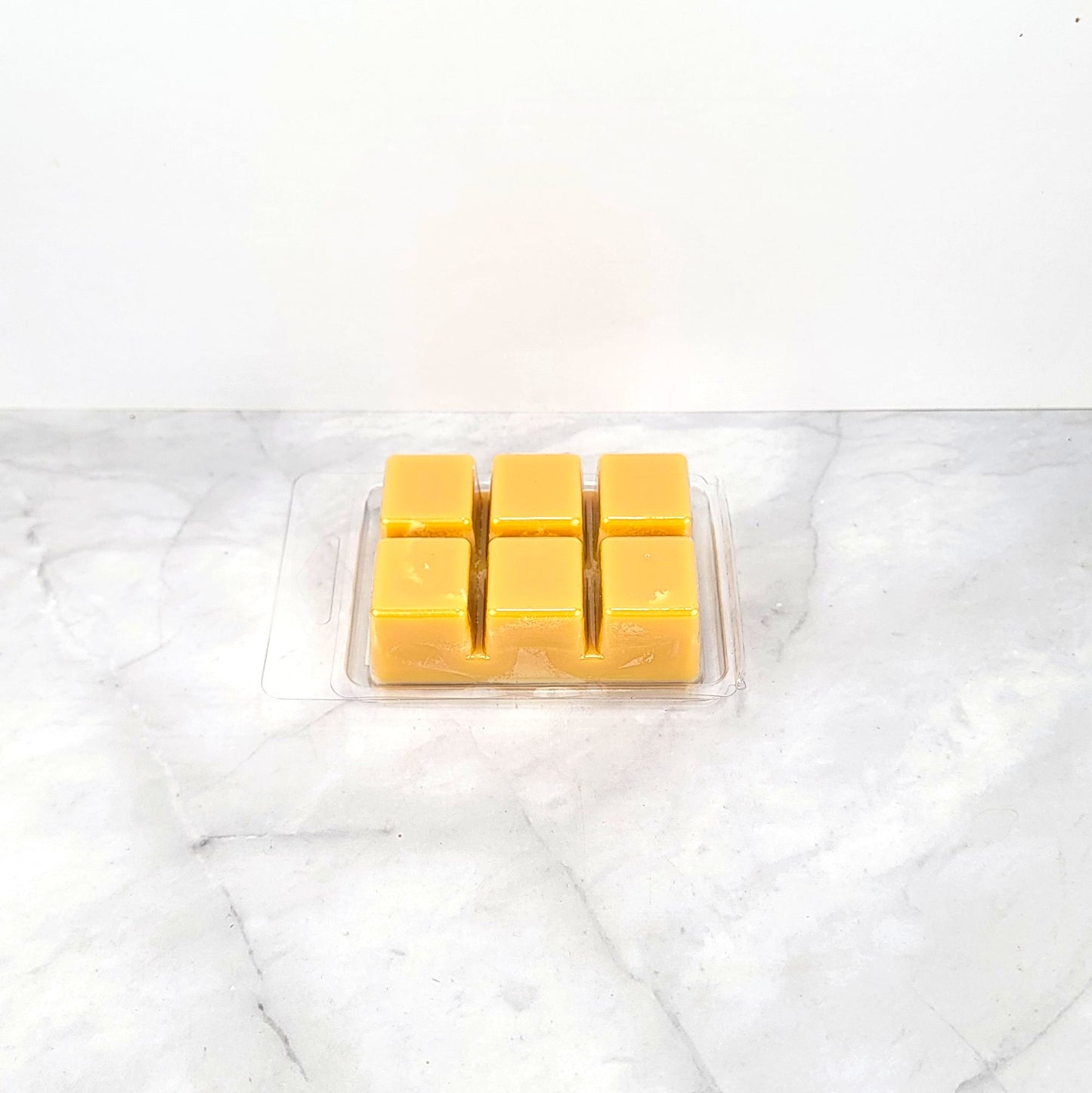 Handcrafted fall-scented wax melt with pumpkin and brown sugar