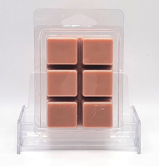 Close-up of 2.5oz Sandalwood Wax Melt with warm, amber glow