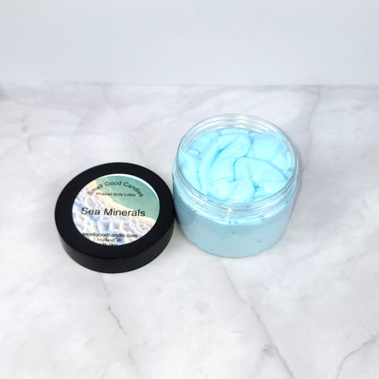 Handmade Sea Minerals Whipped Body Lotion with sea salt, freesia, and moss for smooth skin and a rejuvenating ocean breeze fragrance.