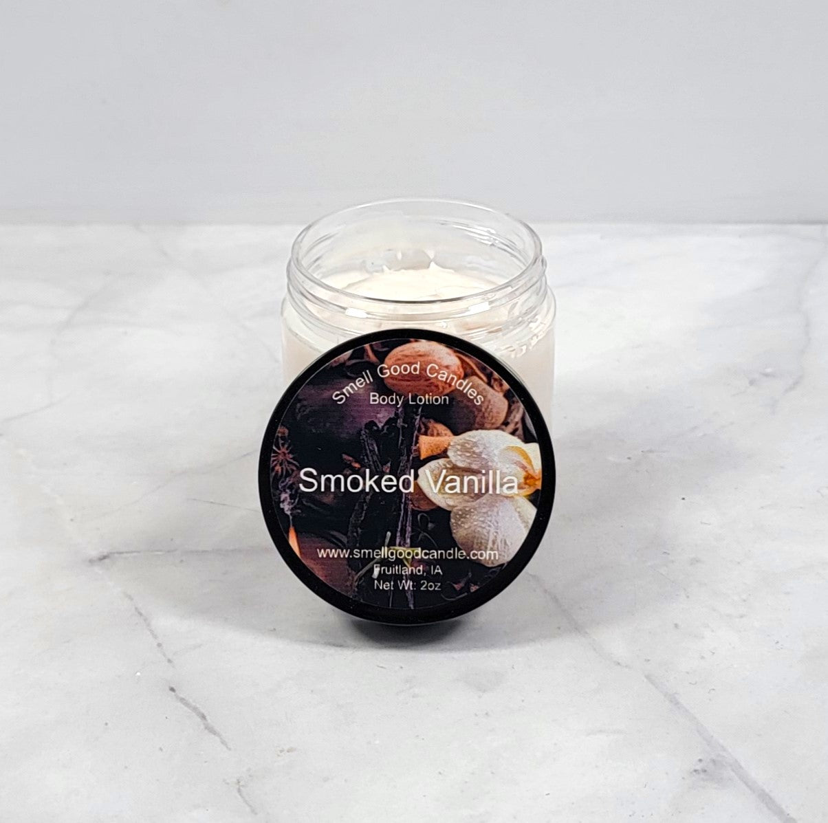 Smoked Vanilla whipped lotion in rustic wood setting