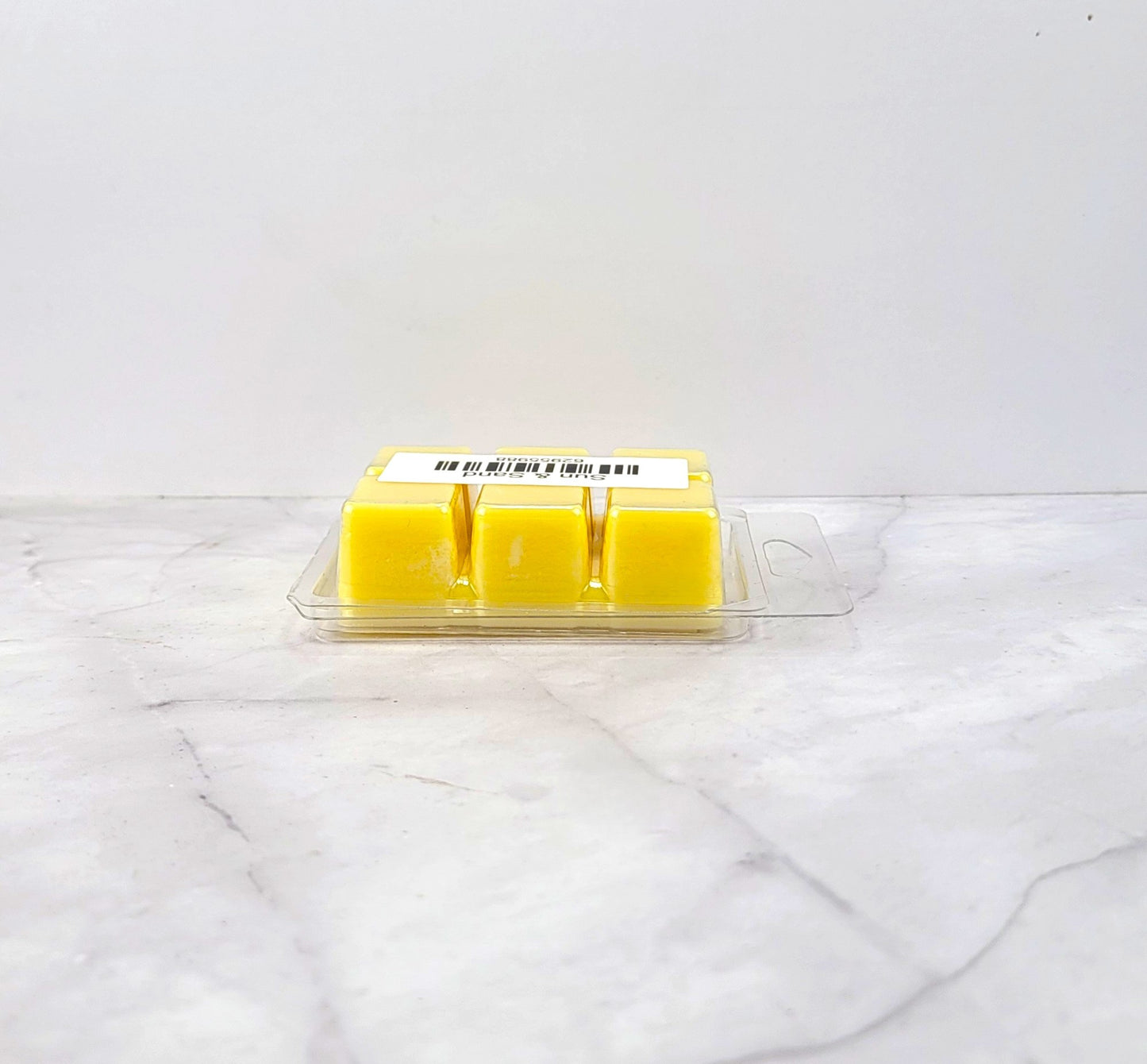 Hand-poured soy wax melt evoking coastal florals and seaside warmth