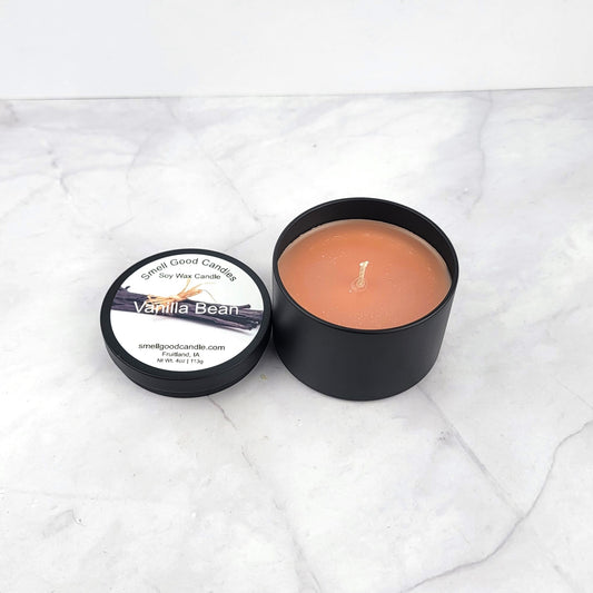 Luxury vanilla-scented candle in an elegant tin for cozy home ambiance.