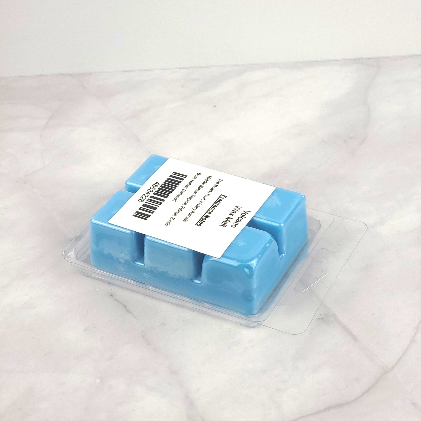 Volcano Soy Wax Melt with tropical fruit, watery accords, and driftwood for a refreshing, island-inspired fragrance.