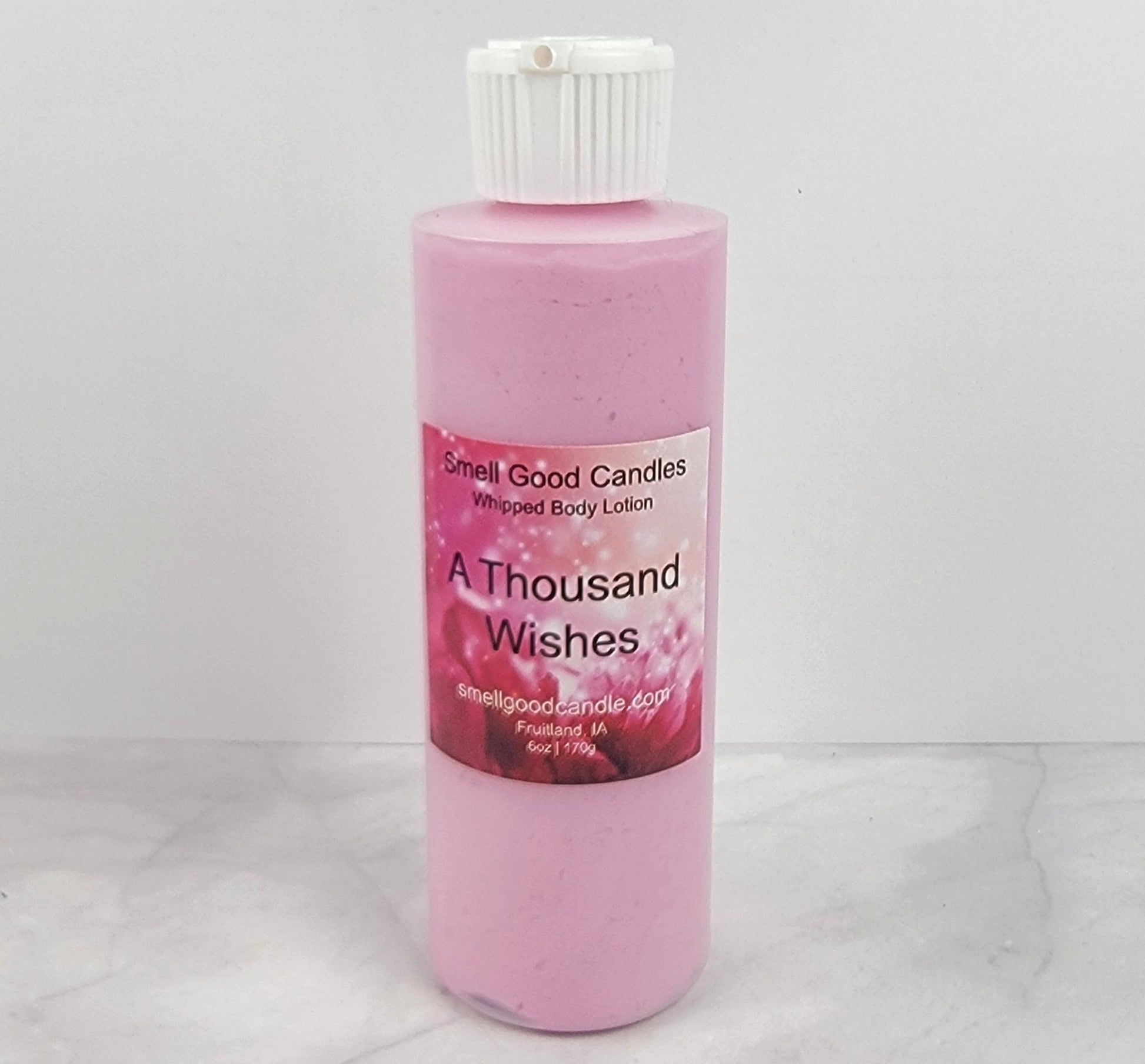 Smooth, whipped texture of A Thousand Wishes Body Lotion in a creamy swirl