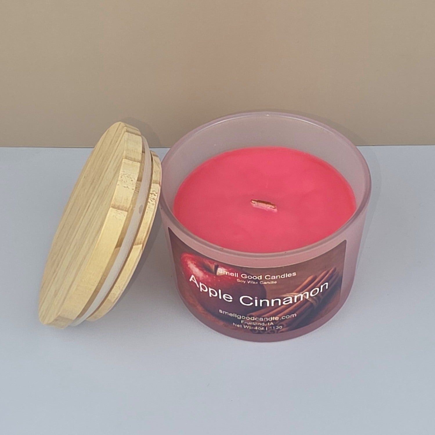 Cozy wood-wick candle creating warm autumn home ambiance