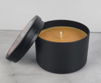 Autumn Night soy wax candle - Open matte black tin showing warm amber colored wax and cotton wick