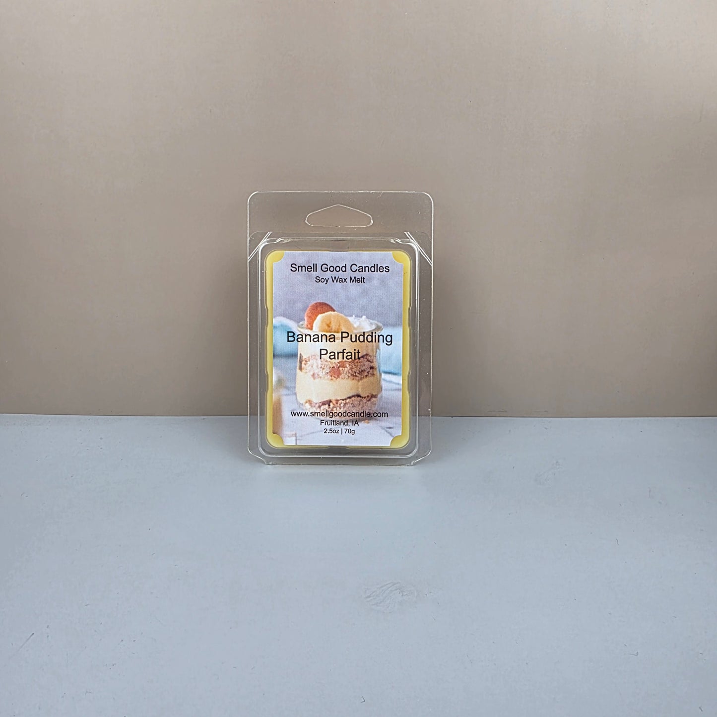 Wax melt package labeled 'Banana Pudding' on a neutral background
