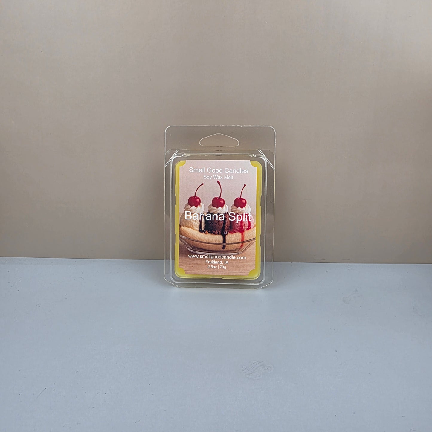 Packaged dessert-themed product on a gray background