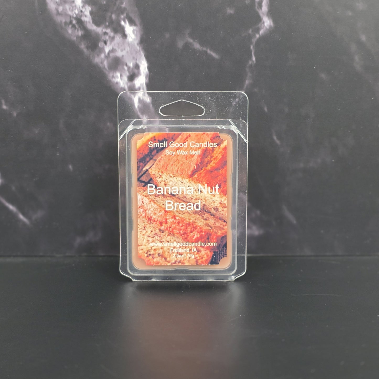 Wax melt packaging labeled 'Banana Nut Bread' by Small Good Candles on a dark background