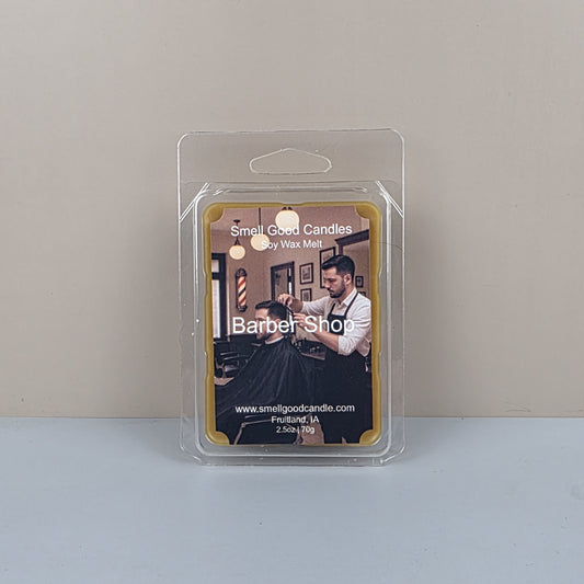 Wax melt packaging with barber shop design on a plain background