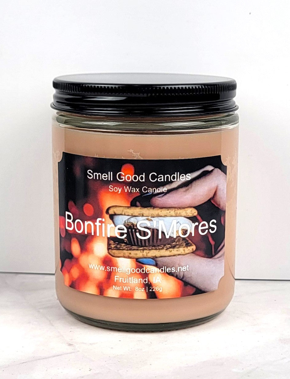 Bonfire S’mores candle glowing in cozy fall setting