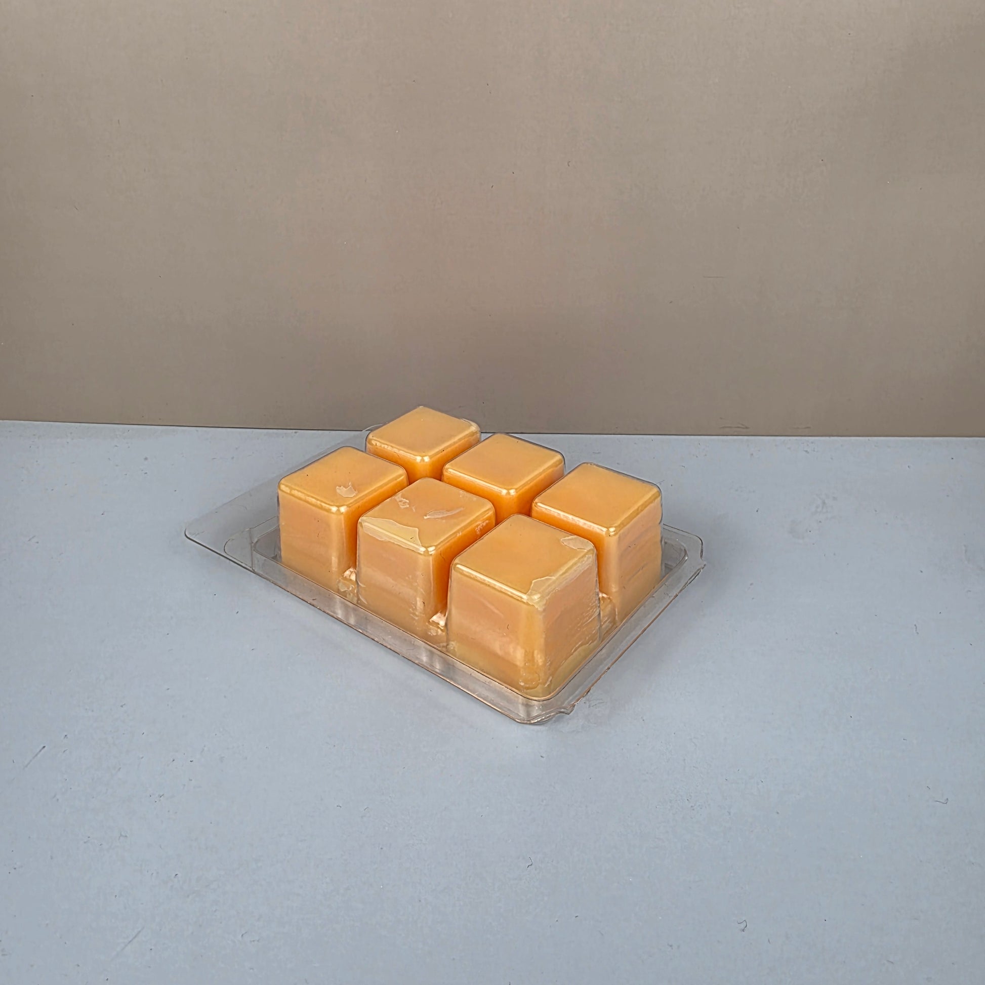 Hexagonal honeycomb wax melt block on a neutral background