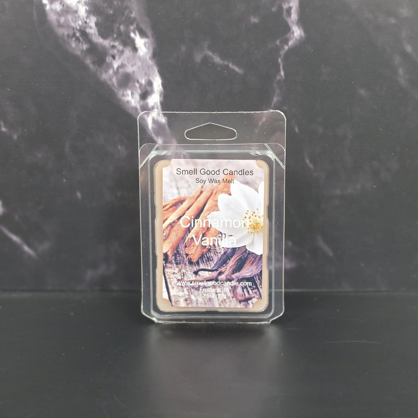 Cinnamon Vanilla wax melt packaging on a dark marble background
