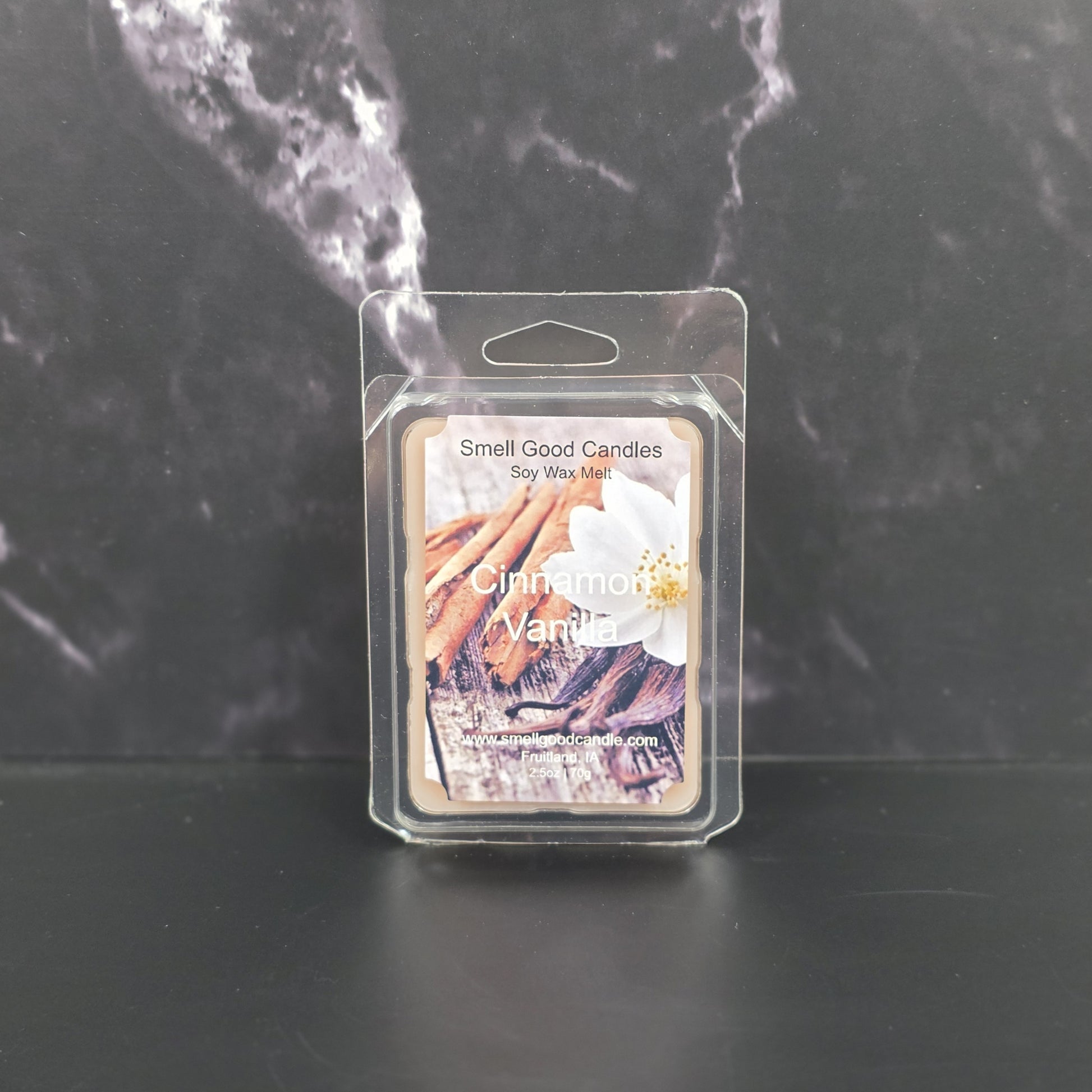 Cinnamon Vanilla wax melt packaging on a dark marble background