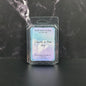 Wax melt packaging labeled 'Clouds In The Sky' on a dark marble surface