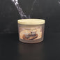 Coconut Pumpkin Latte candle with a wooden lid on a black background