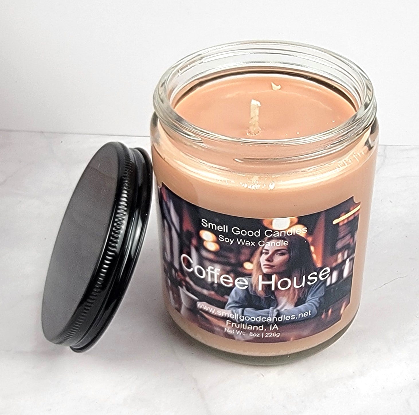Hand-poured soy candle in an 8oz jar with a cozy café-inspired fragrance