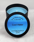 Cool Water soy wax candle - Open matte black tin showing bright blue fresh-scented wax