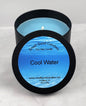 Cool Water soy wax candle - Open matte black tin showing bright blue fresh-scented wax