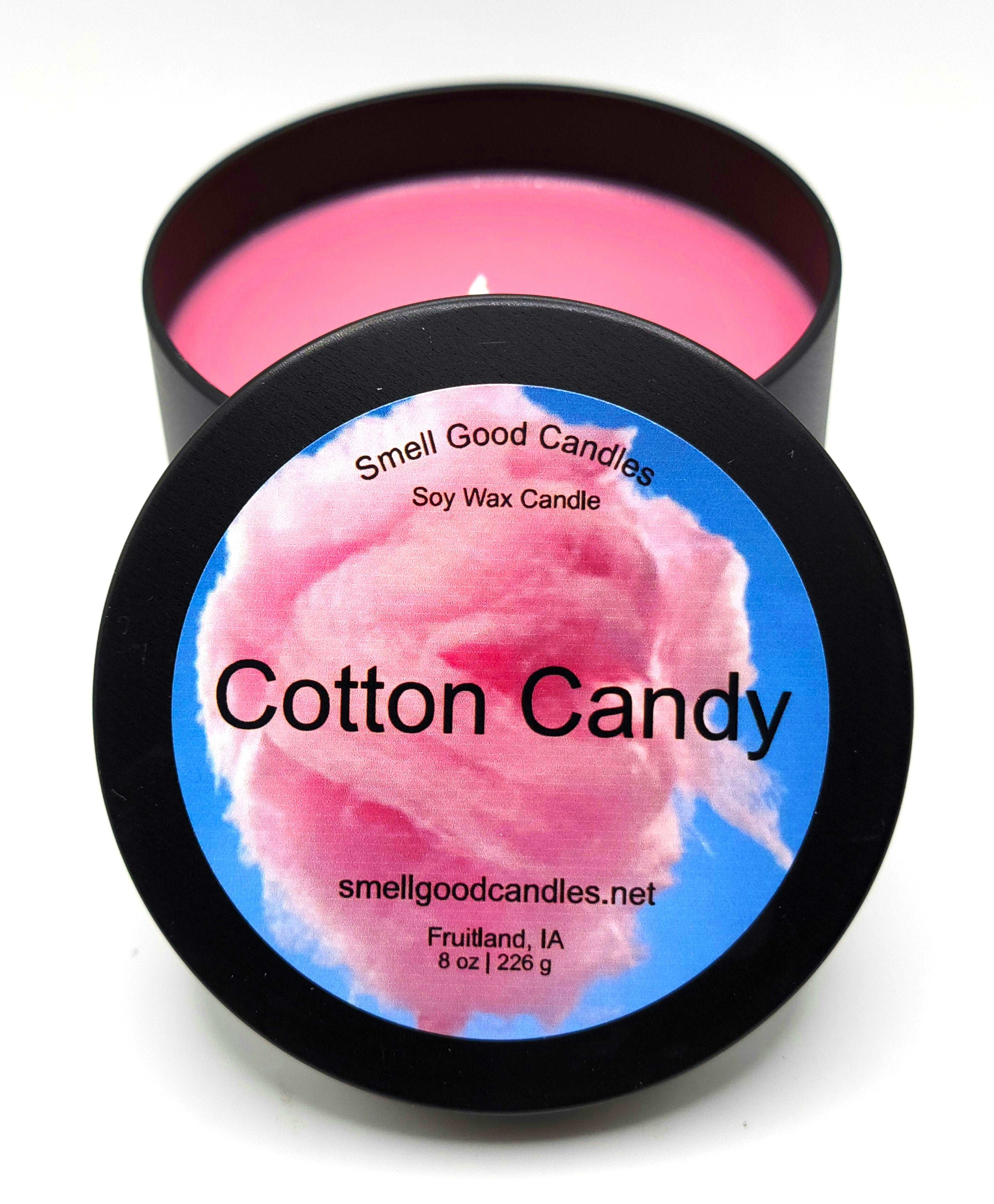 Cotton Candy soy wax candle - Open matte black tin showing bright pink sweet scented wax, 8 oz, for fun gourmand candle lovers.