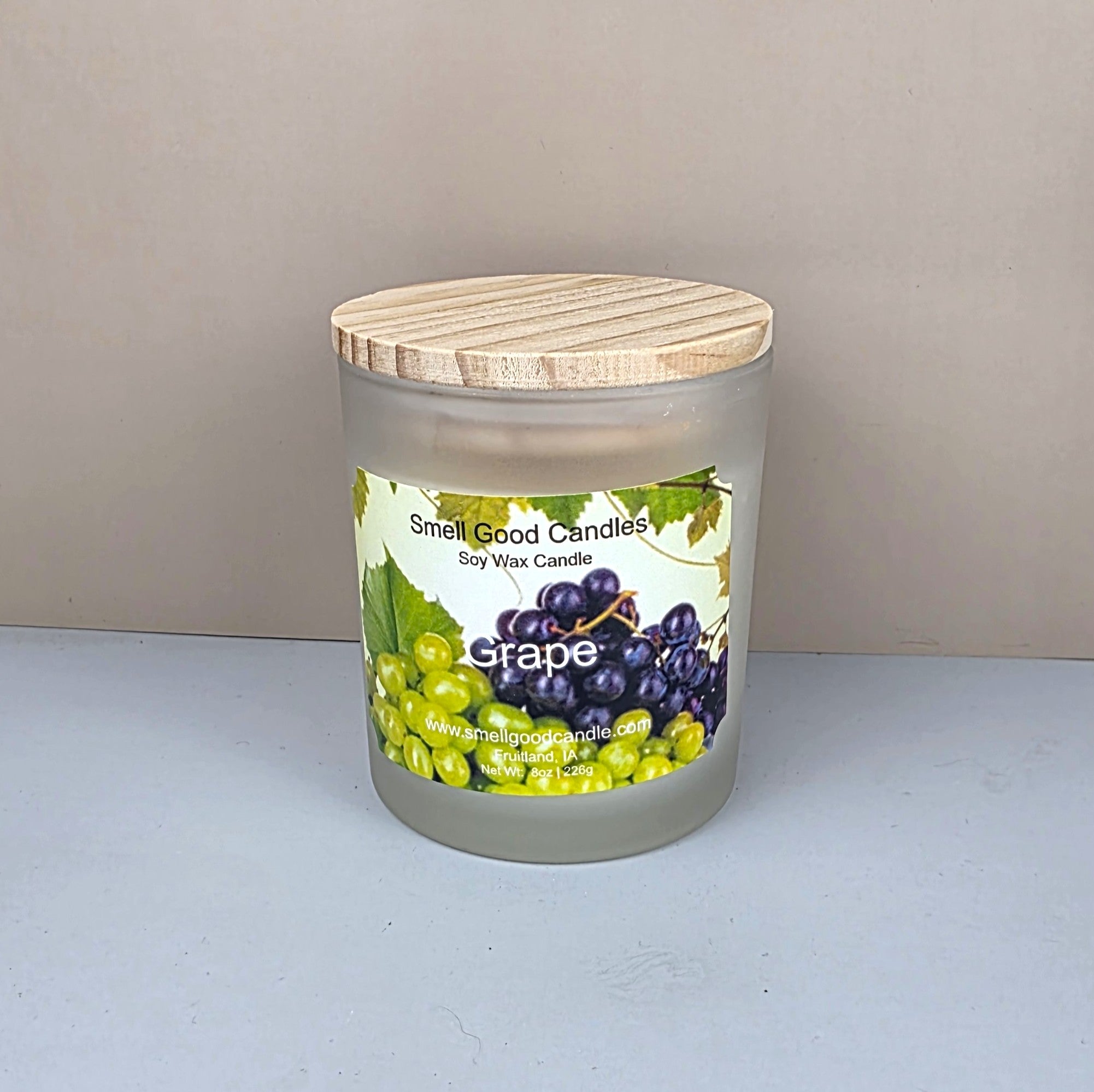 Grape soy wax candle in frosted jar with wood lid