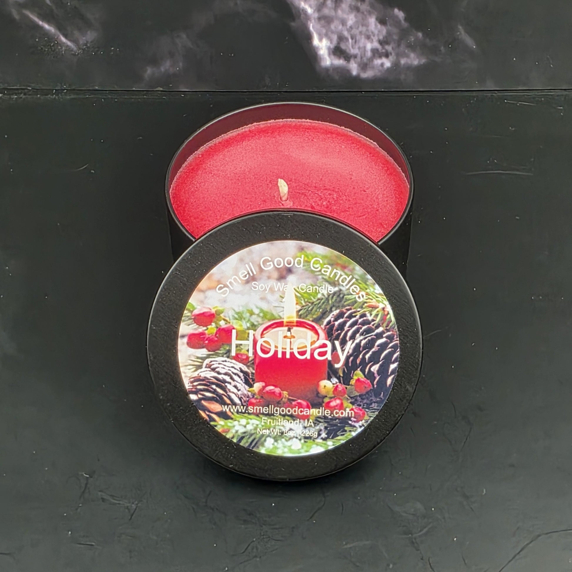 Holiday soy wax candle with orange, red currant, and raspberry aroma