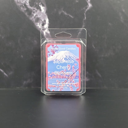 Packaged candle labeled 'Japanese Cherry Blossom' on a dark background