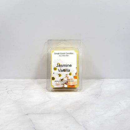 Wax melt in clear packaging with a label showing jasmine flowers and vanilla on a white background
