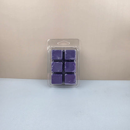 Pack of purple wax melts in a clear plastic packaging on a beige and white background