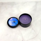 Hand-poured candle with violet, jasmine, and musk fragrance.