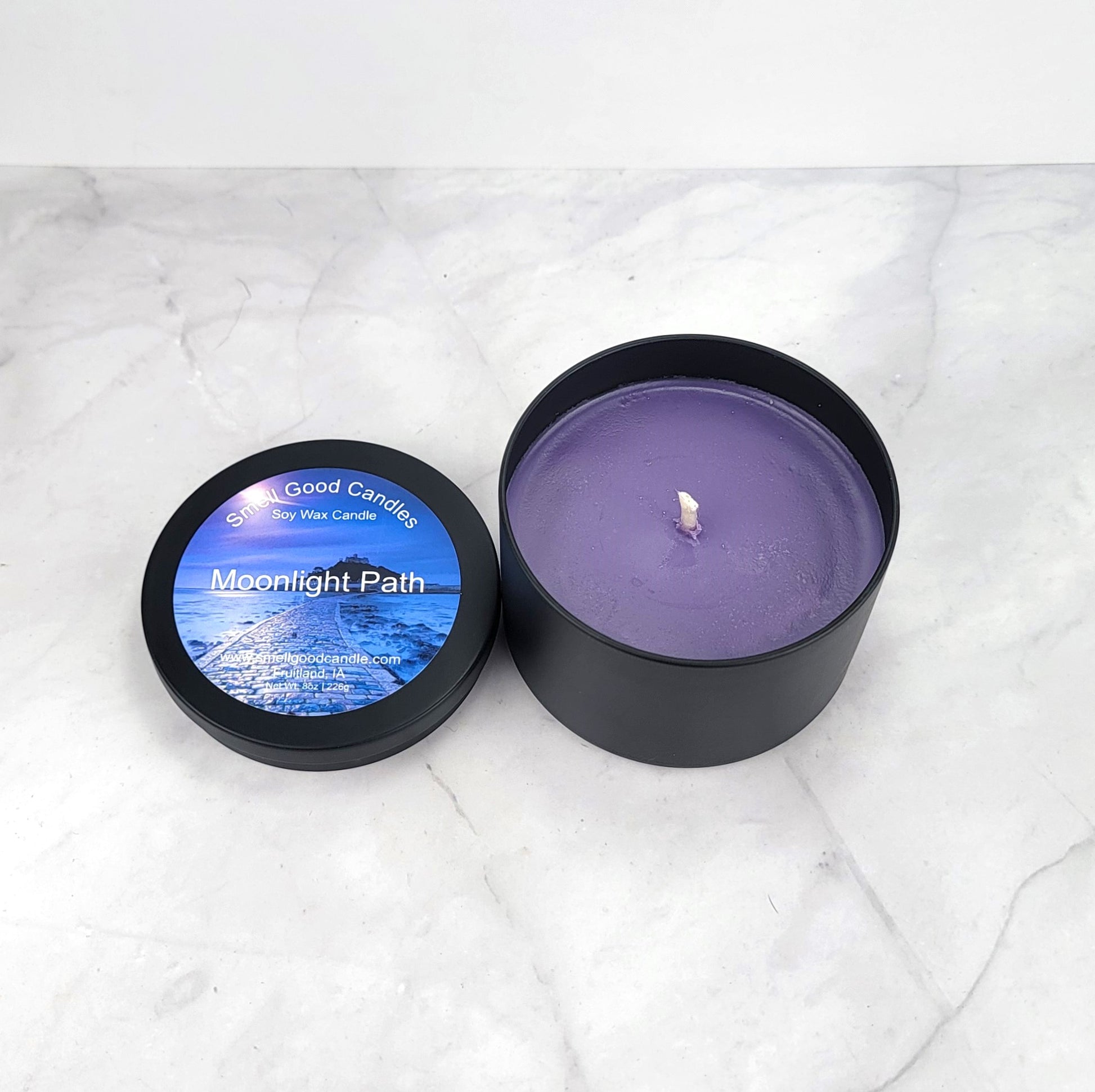 Moonlight Path 8oz candle in a cozy, softly lit setting.