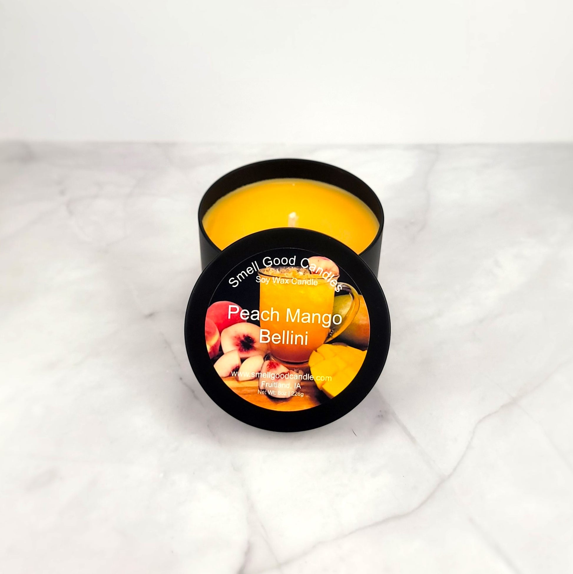Peach Mango Bellini 8oz soy wax candle with citrus and tropical fruit notes.