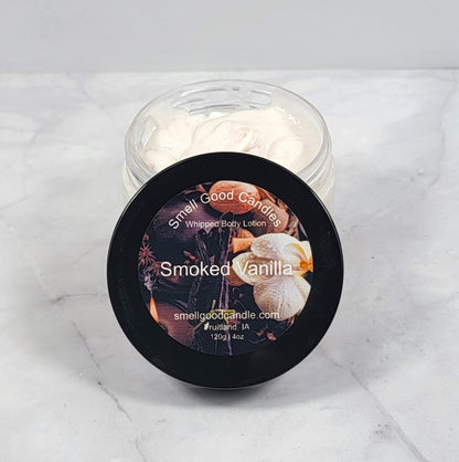 Smoked Vanilla whipped lotion in rustic wood setting