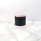 Pink wax candle evoking strawberries, lemon, and sugar