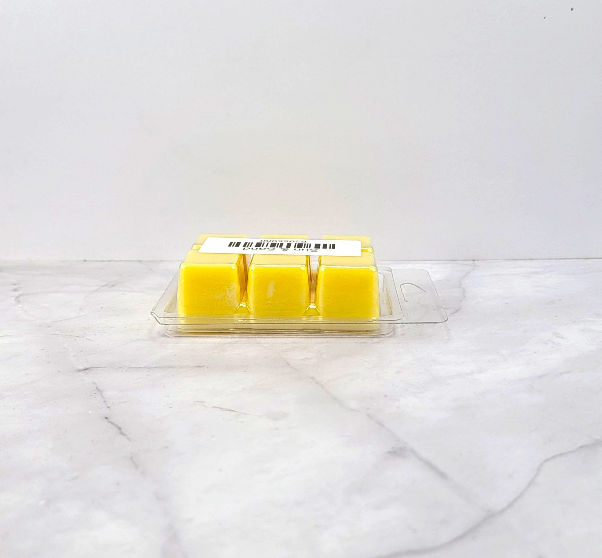 Hand-poured soy wax melt evoking coastal florals and seaside warmth