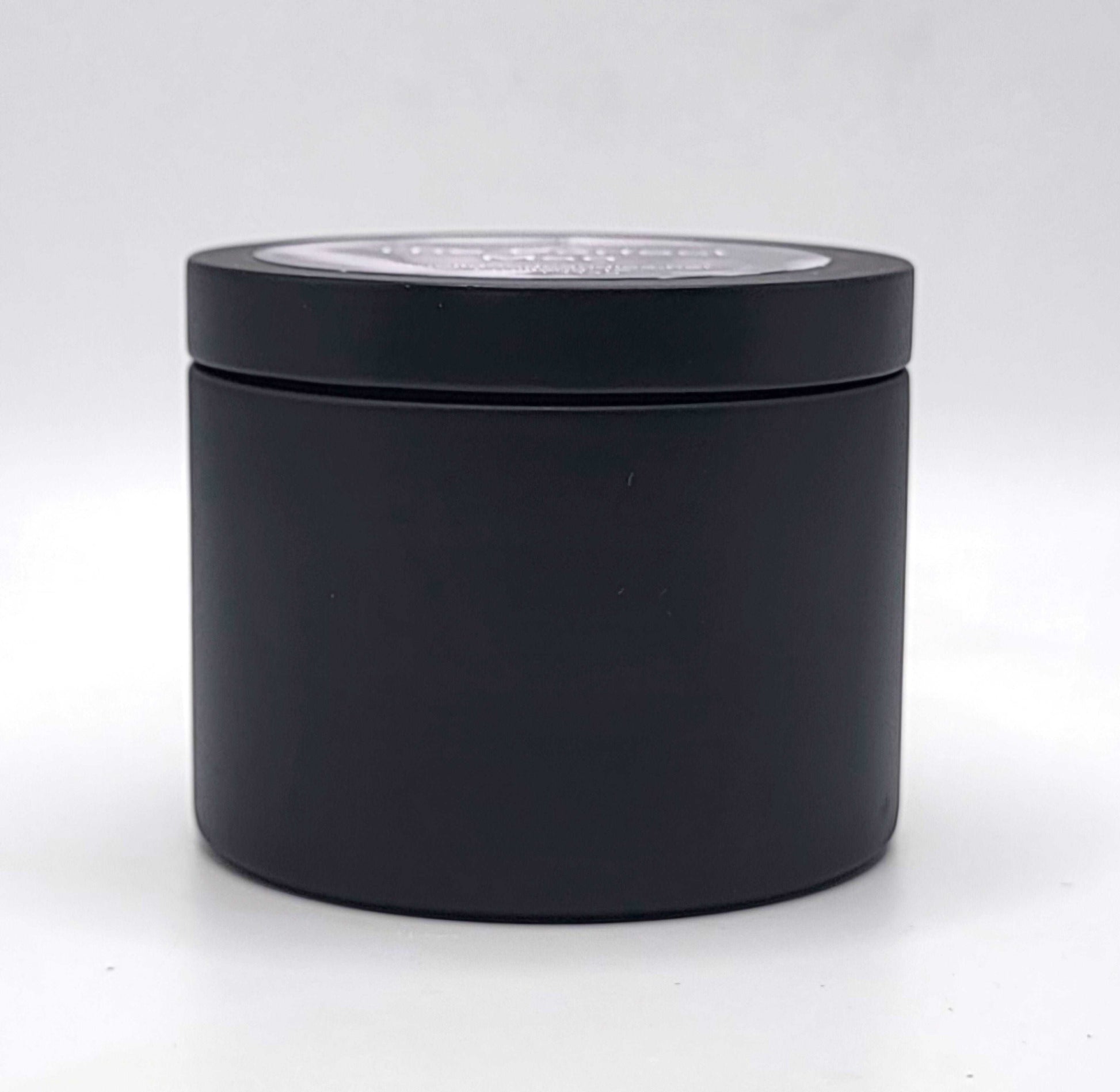 Hand-poured 100% soy wax candle with citrus, spice, and rich woody notes.