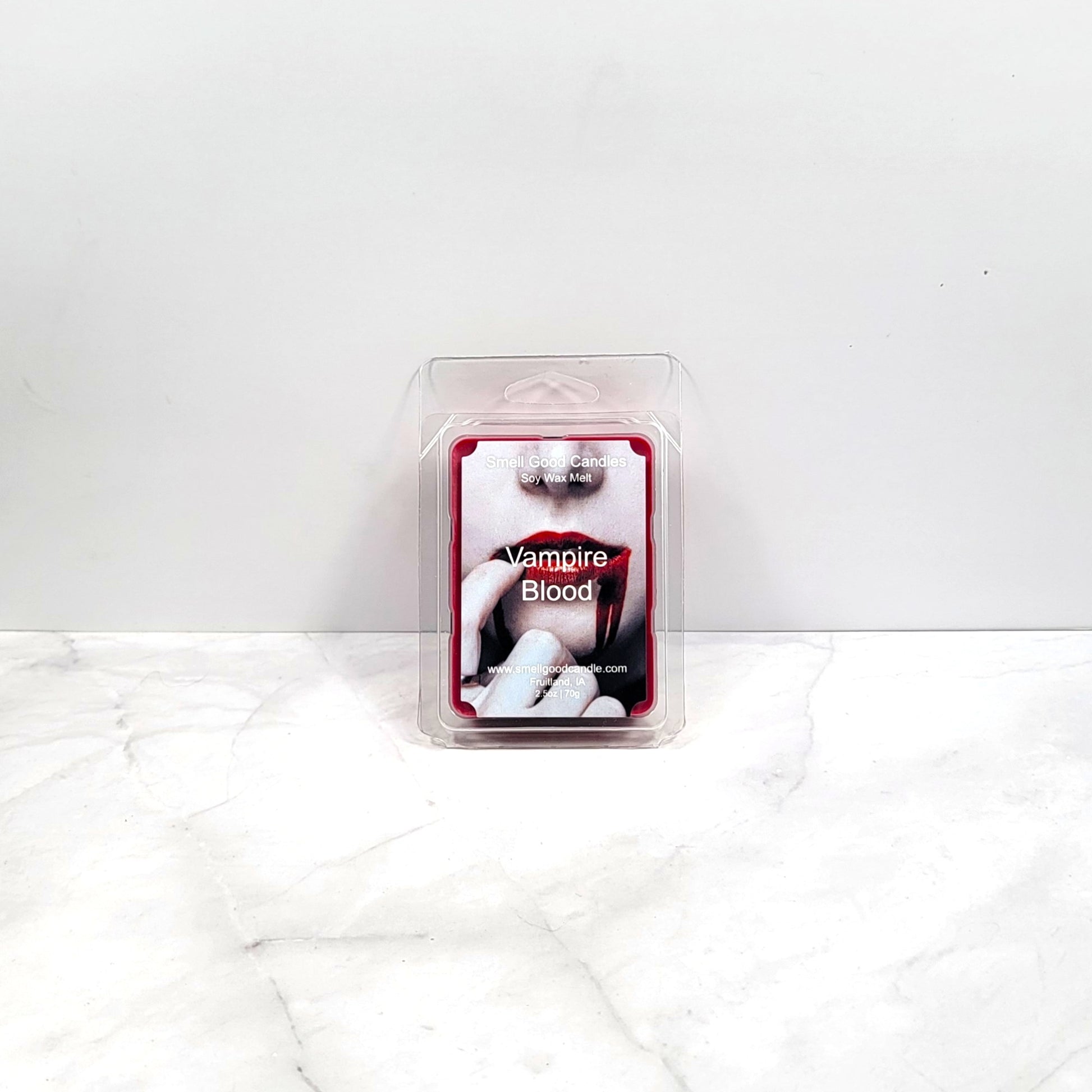 Vampire Blood soy wax melt with gothic decor and candlelight